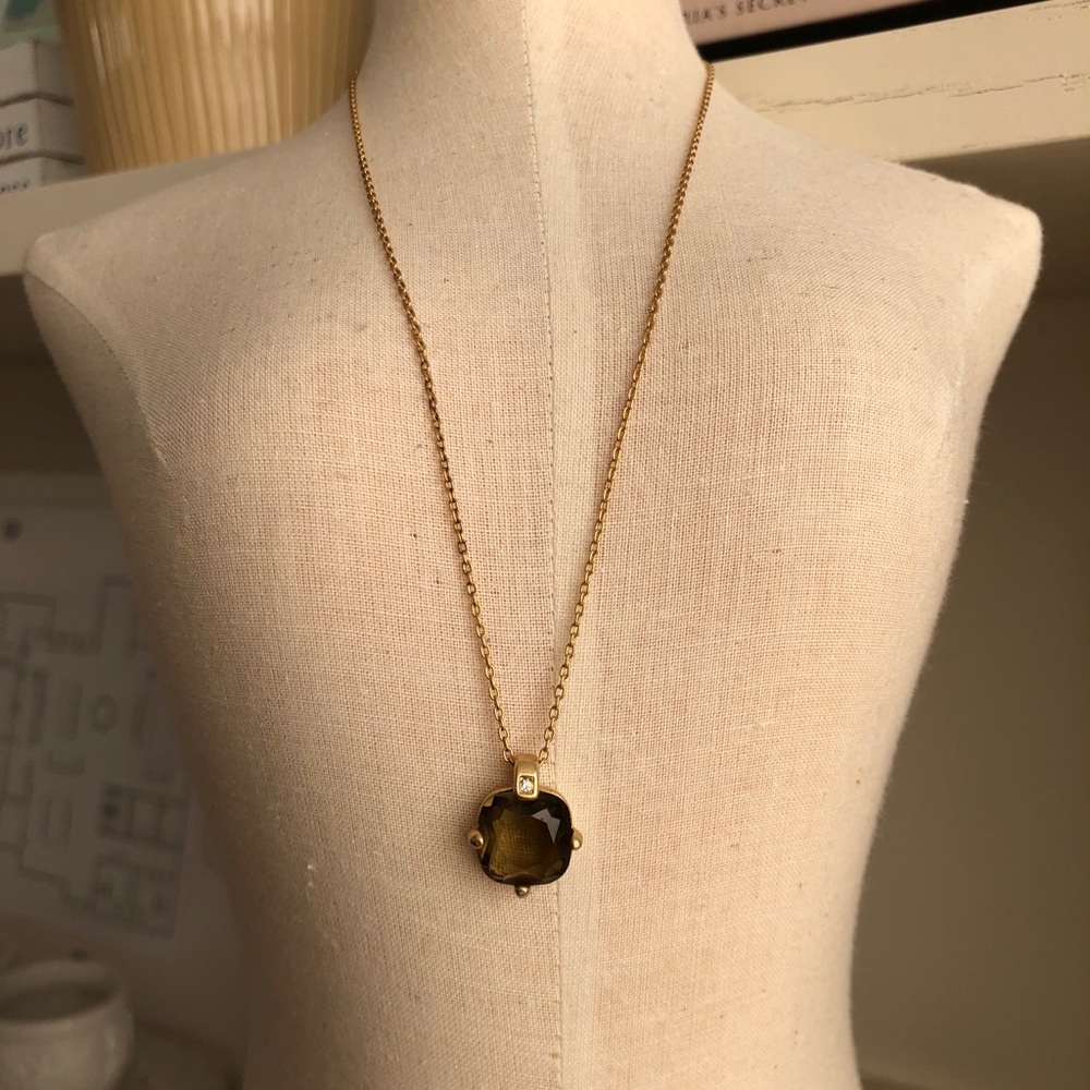 Gold necklace with gemstone